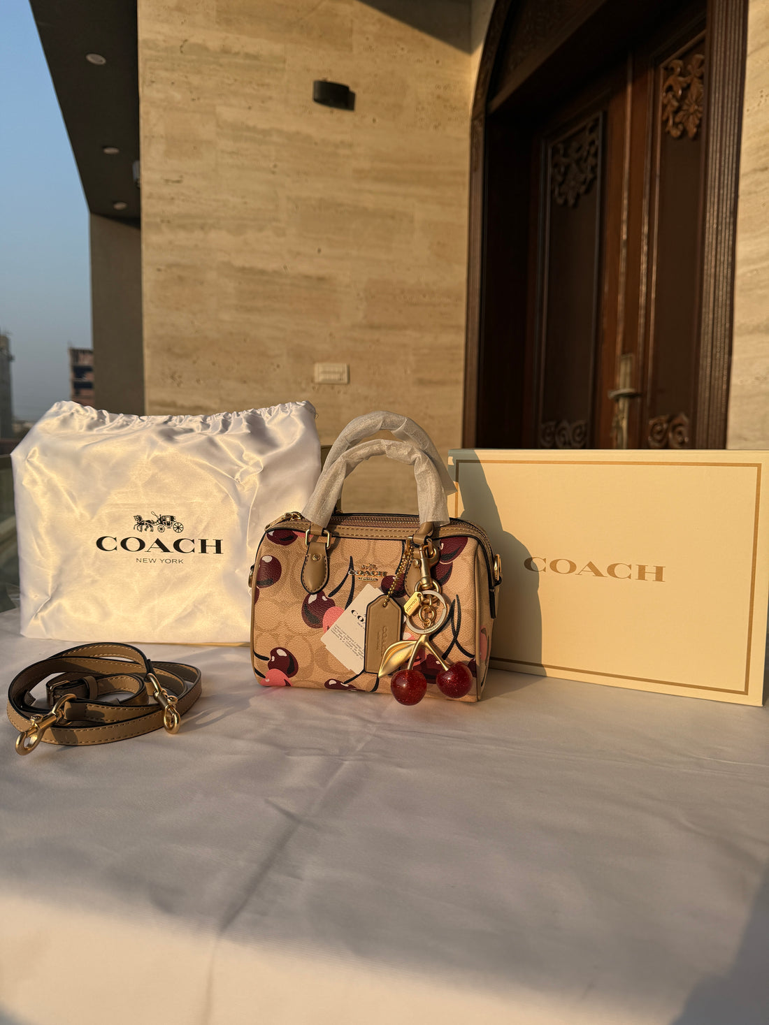 COACH CHERRY PATTERN BAG IN BROWN WITH CHERRY CHARM