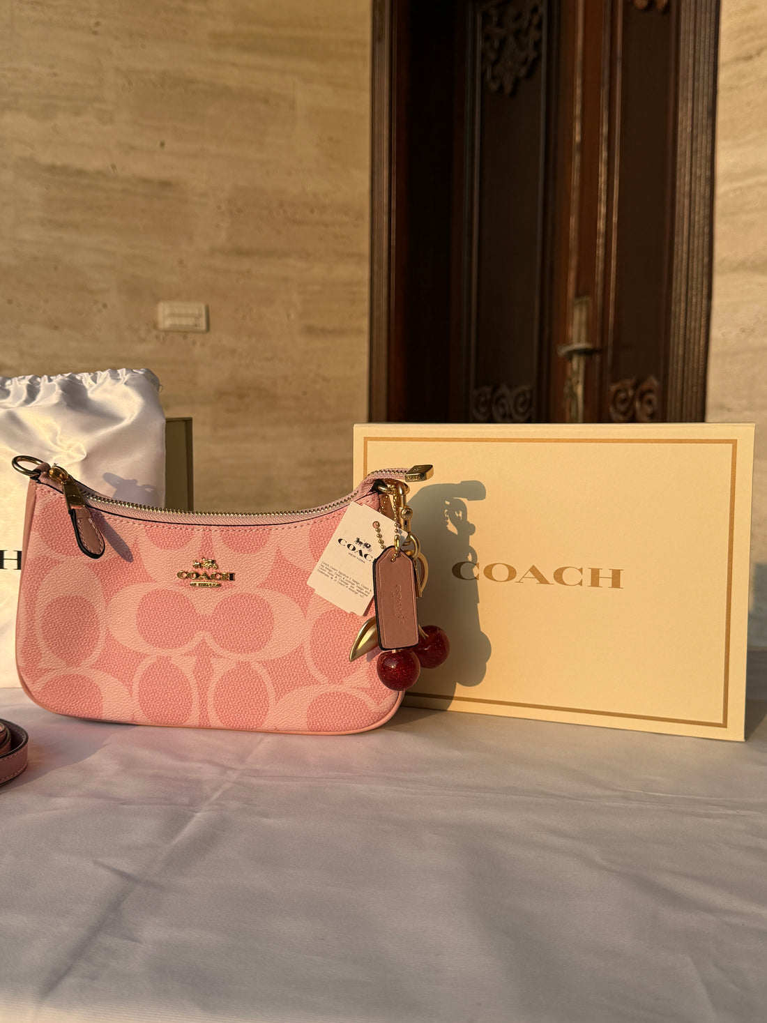 COACH PINK BAG WITH CHERRY CHARM AND 2 STRIPS