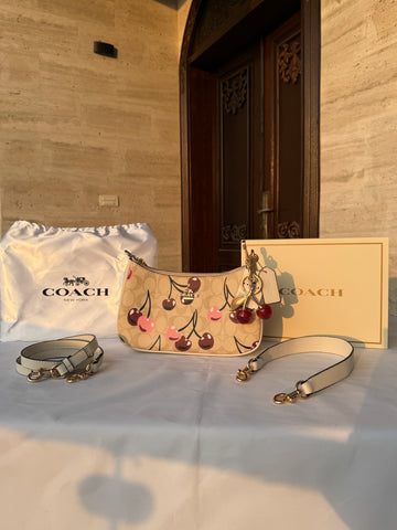 COACH BEIGE CHERRY PATTERN BAG WITH CHERRY CHARM AND 2 STRIPS