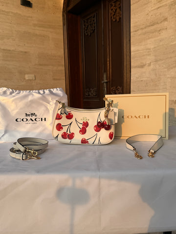 COACH WHITE CHERRY PATTERN BAG WITH CHERRY CHARM AND 2 STRIPS