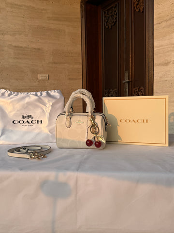 COACH WHITE PATTERN BAG WITH CHERRY CHARM