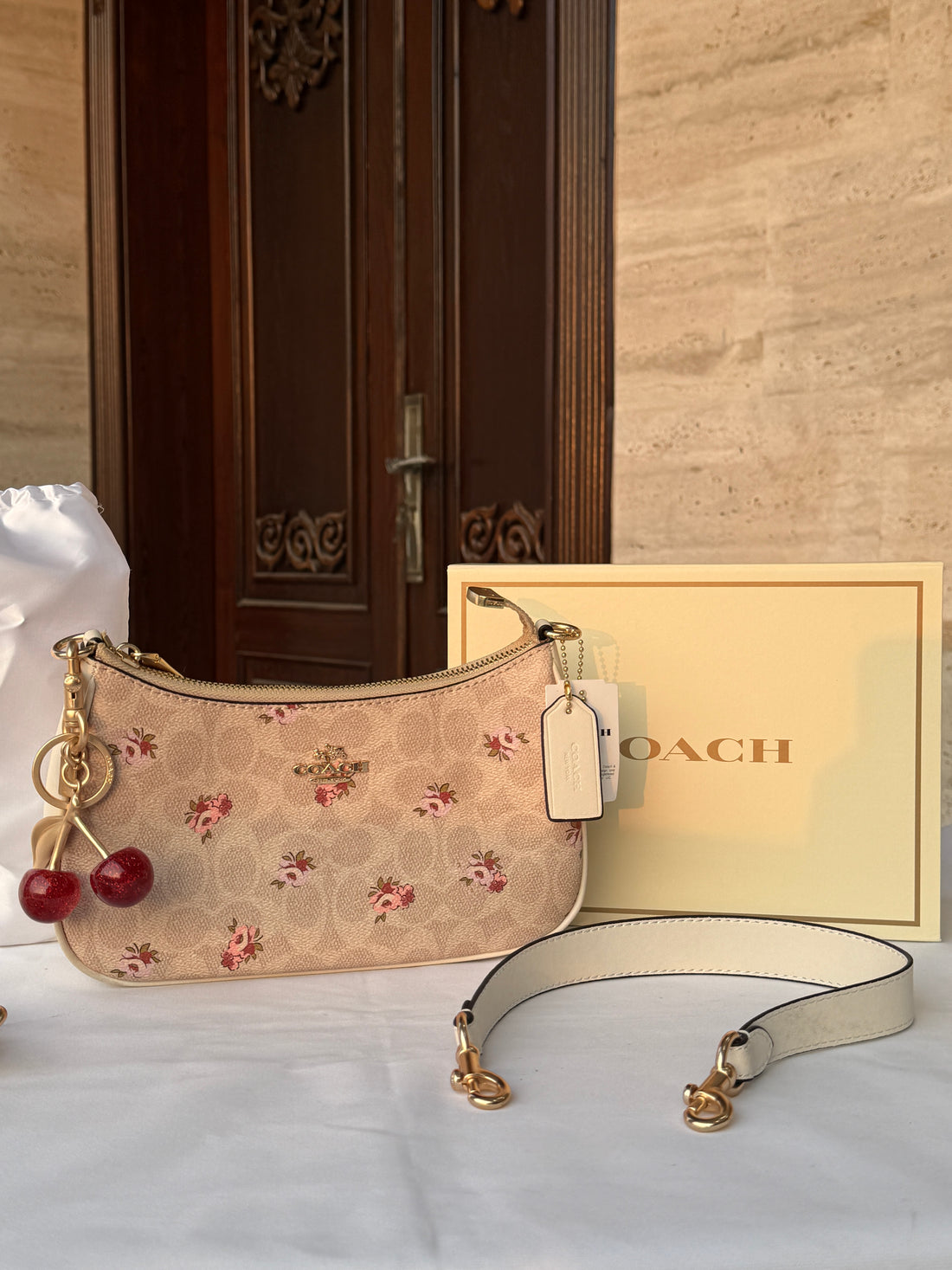 COACH LIGHT BROWN FLOWER PATTERN BAG WITH CHERRY CHARM AND 2 STRIPS